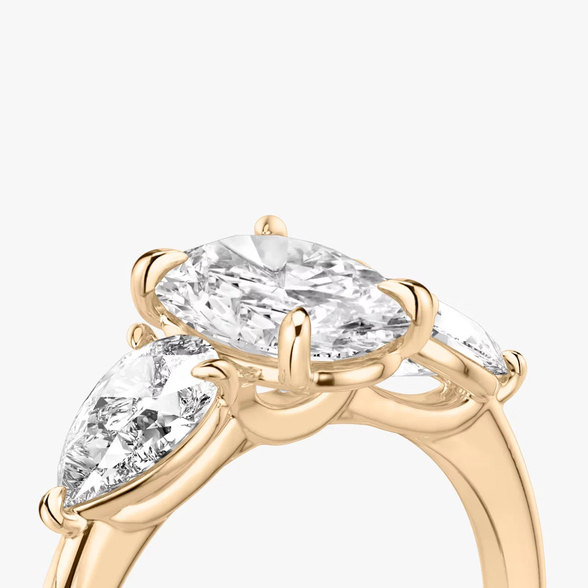 The Three Stone Oval Yellow Gold Engagement Ring