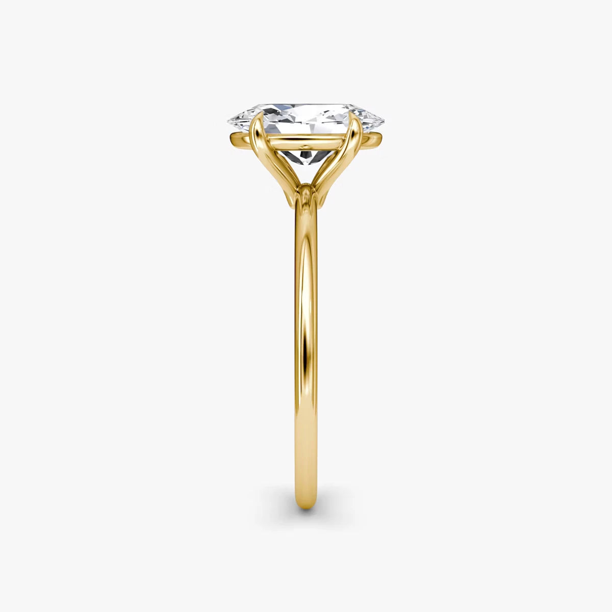 The Petite 4-Prong Solitaire Oval Yellow Gold Engagement Ring
