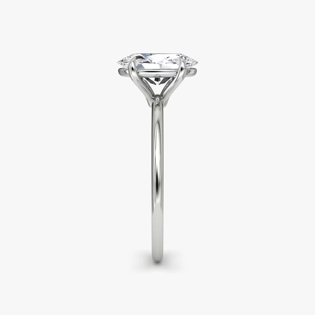 The Petite 4-Prong Solitaire Oval Yellow Gold Engagement Ring