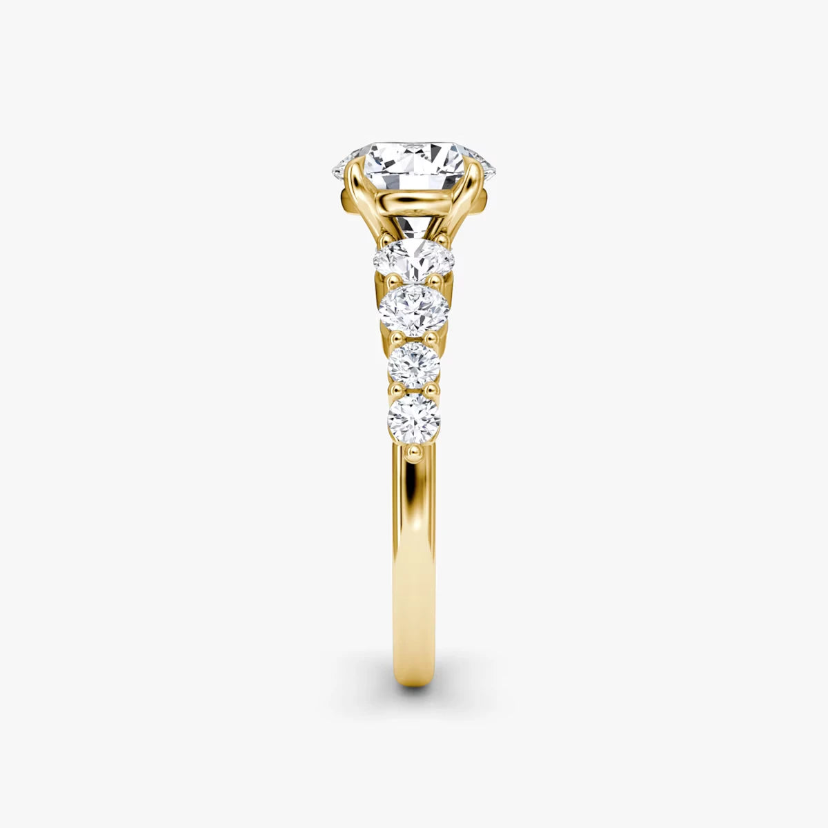 The Graduated Band Round Brilliant Yellow Gold Engagement Ring