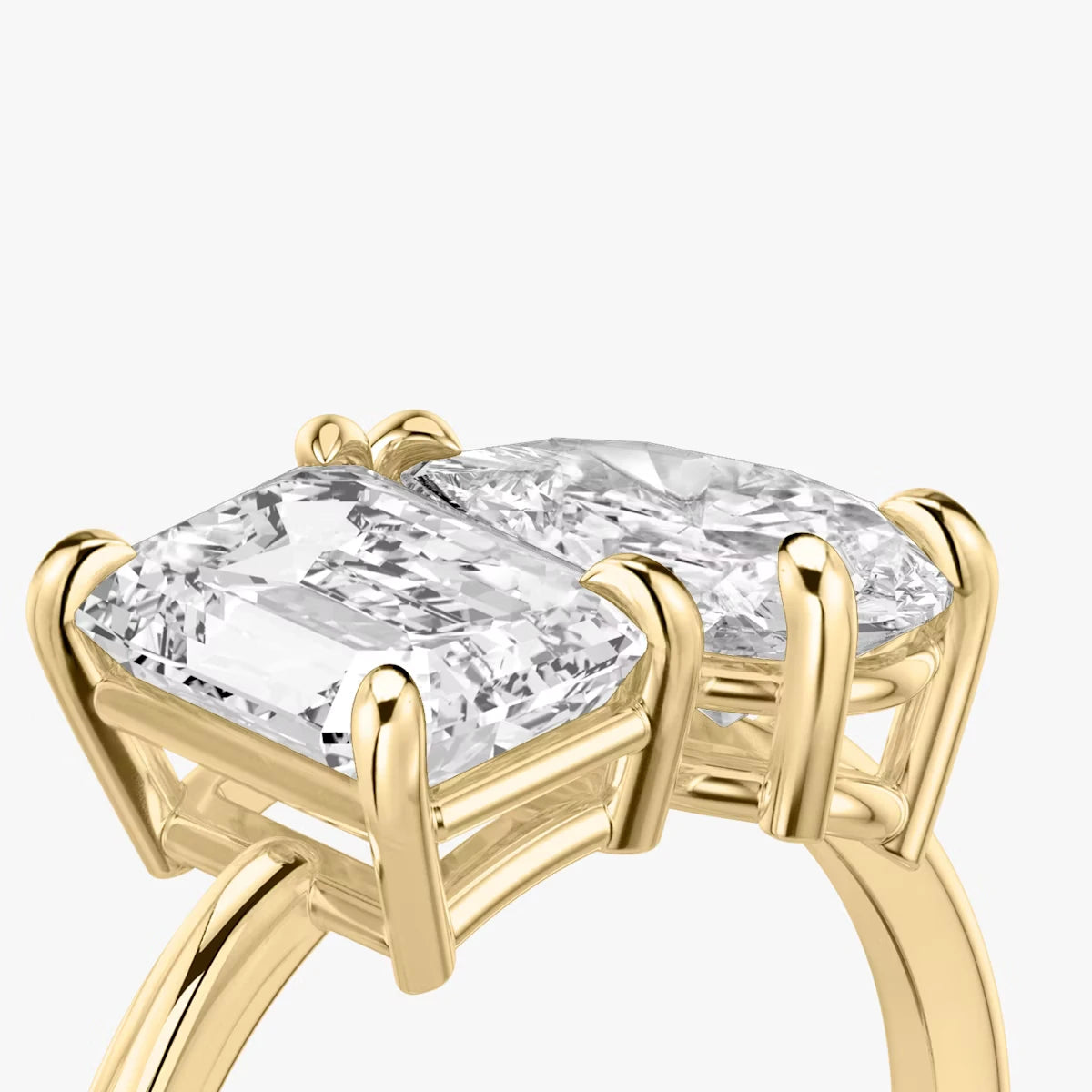 The Toi et Moi Emerald and Pear Yellow Gold Engagement Ring