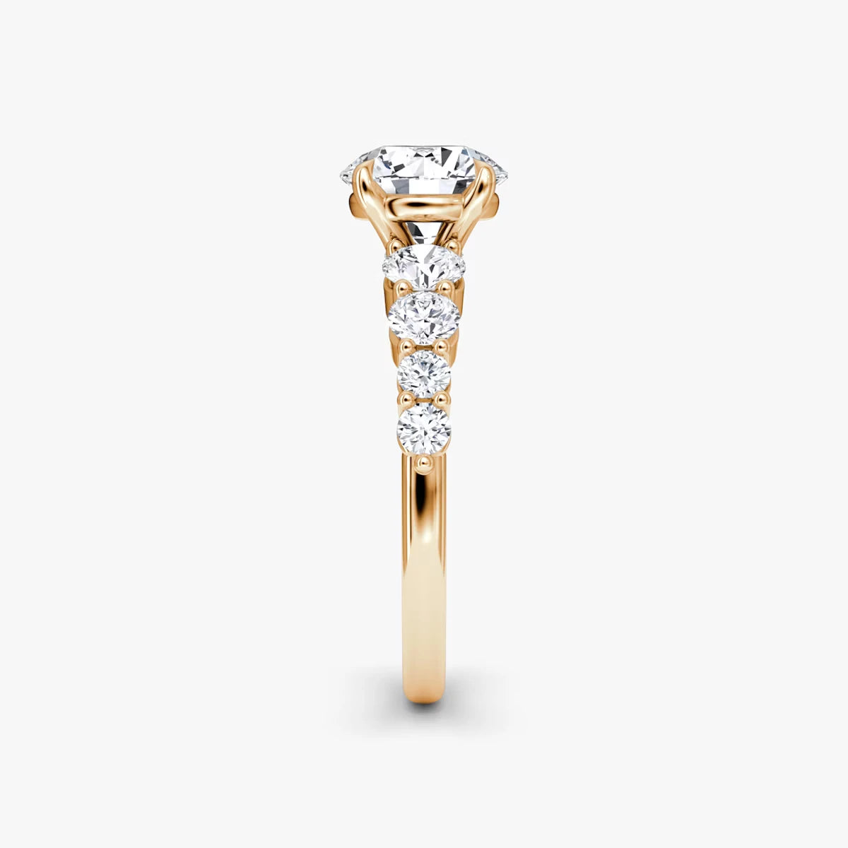 The Graduated Band Round Brilliant Yellow Gold Engagement Ring