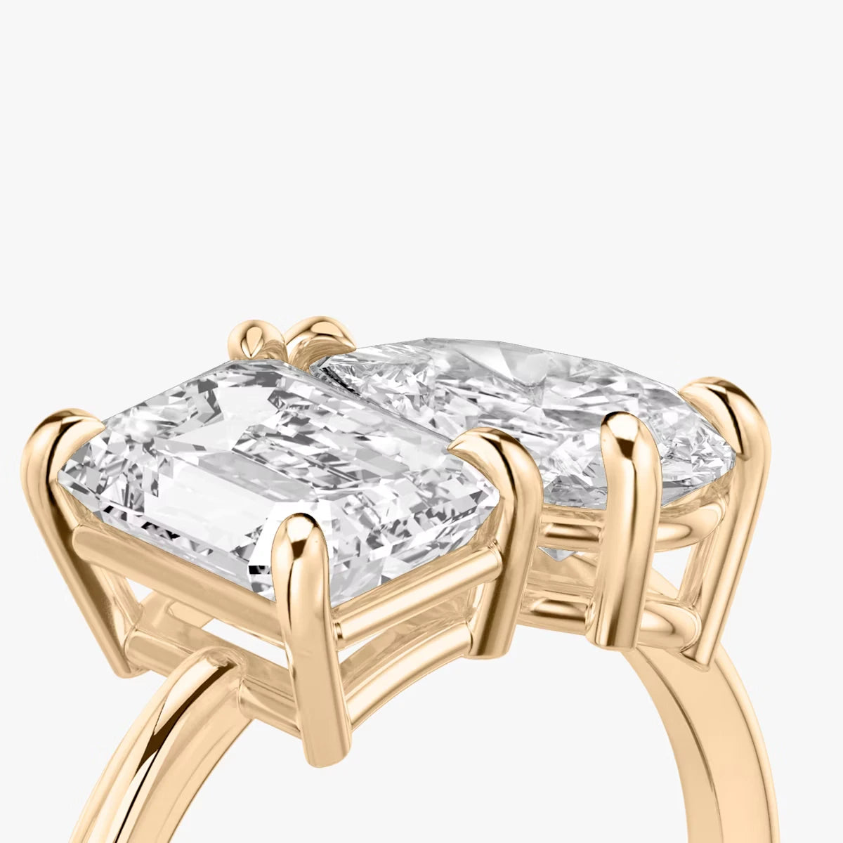 The Toi et Moi Emerald and Pear Yellow Gold Engagement Ring